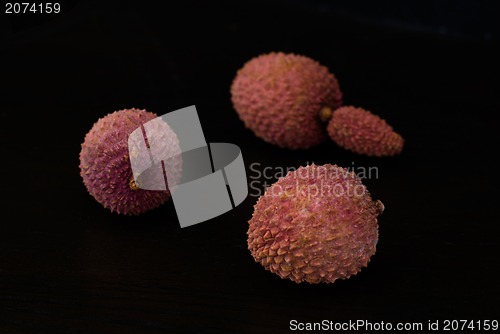 Image of Exotic lychee fruit on dark background