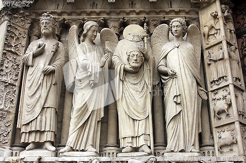 Image of Emperor Constantine, an angel, Saint Denis holding his head, and another angel