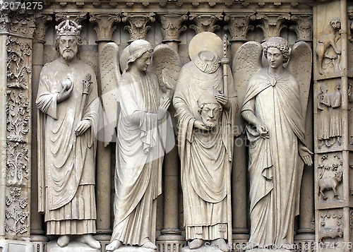 Image of Emperor Constantine, an angel, Saint Denis holding his head, and another angel