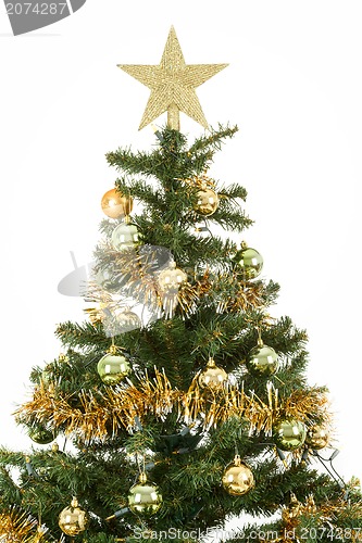 Image of Decorated christmas tree with yellow and green balls 