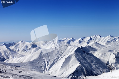 Image of Snowy mountains and blue sky