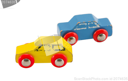 Image of pair wooden blue yellow retro toy cars isolated 