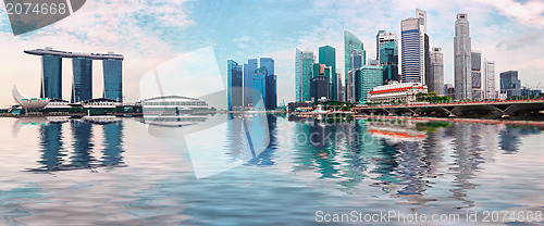 Image of Singapore skyline with skyscrapers and reflection in water