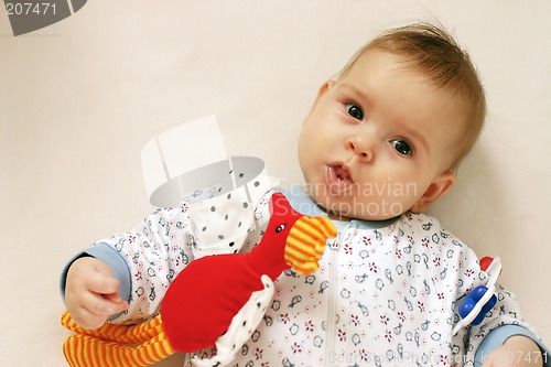 Image of Small baby with toys