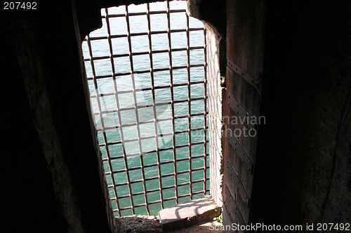 Image of Grilled castle window overlooking the sea