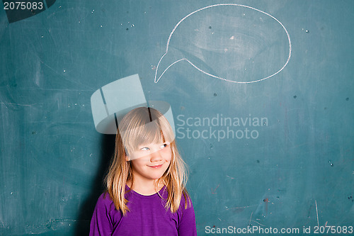 Image of Young girl and idea bubble on chalkboard