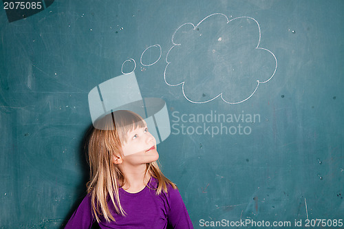 Image of Young girl and idea bubble on chalkboard