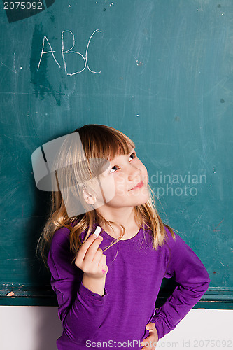 Image of Young girl and chalkboard with letters