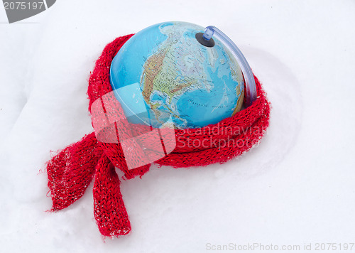 Image of red scarf earth globe sphere winter snow concept 