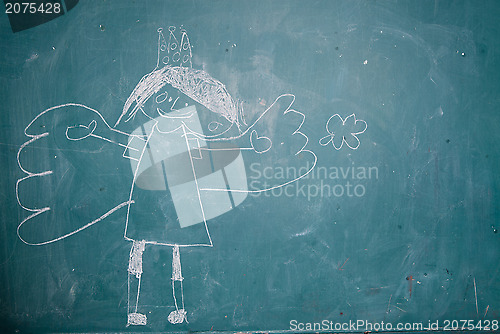 Image of Drawing of angel princess on chalkboard by child