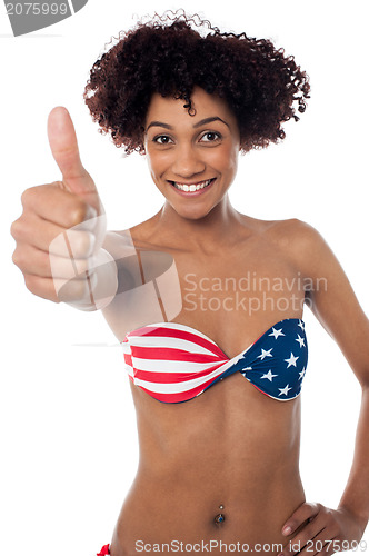 Image of Stars and stripes bikini model showing thumbs up