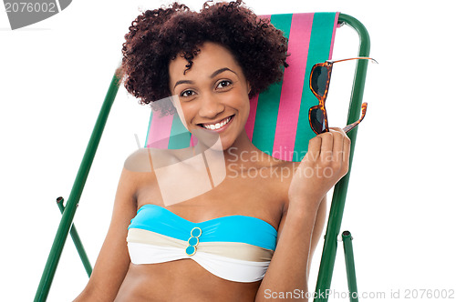 Image of Glamorous woman in lingerie relaxing on a deckchair