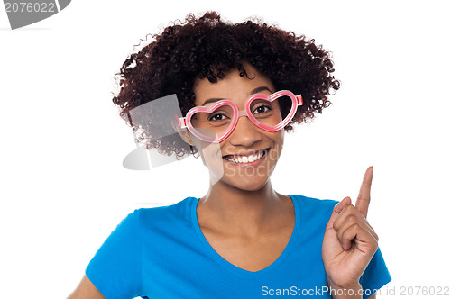 Image of Pretty woman wearing funny heart shaped frame