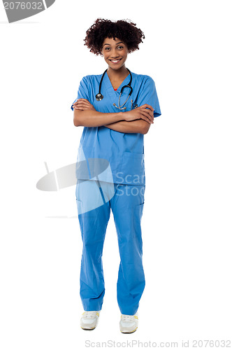 Image of Cheerful nurse posing with arms crossed