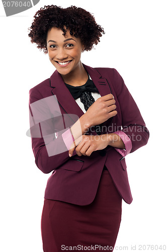 Image of Businesswoman striking stylish pose, confidently