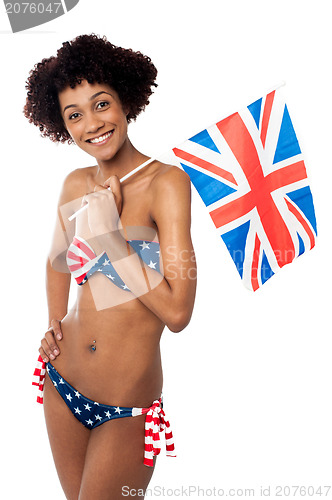 Image of Stars and stripes bikini model holding UK flag