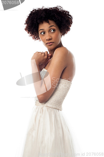 Image of Amazed lady looking backwards intently