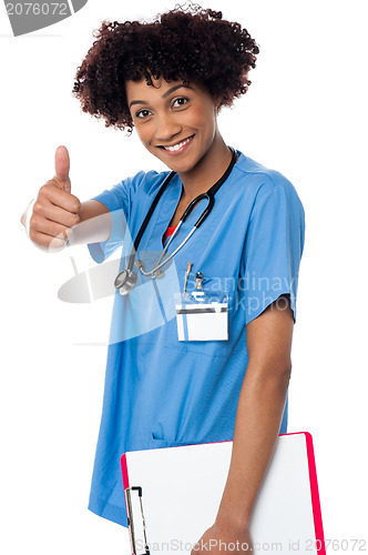 Image of Happy lady doctor showing thumbs up sign