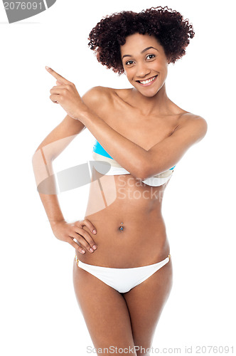 Image of Sexy woman with curvy body pointing sideways