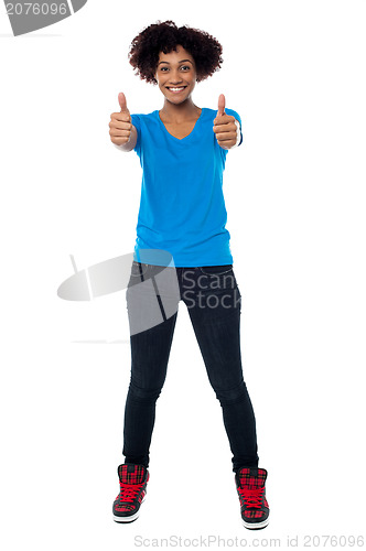 Image of Beautiful trendy woman showing double thumbs up