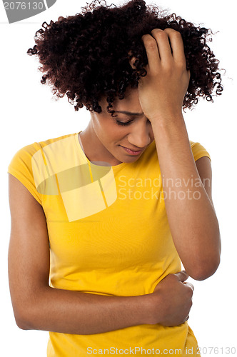 Image of Young woman suffering from headache