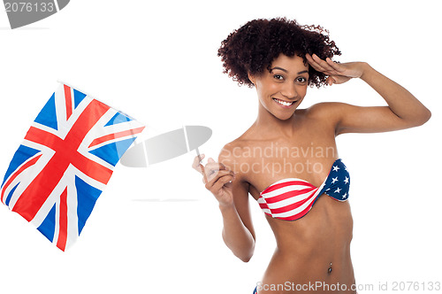 Image of Hot American bikini model saluting and waving UK flag