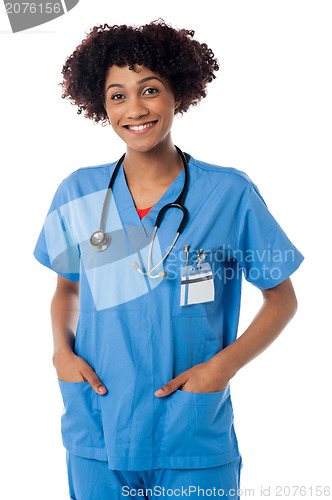 Image of Friendly female doctor smiling isolated over white