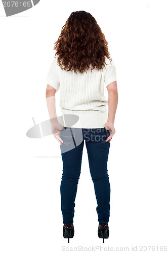 Image of Back view of a long haired woman over white