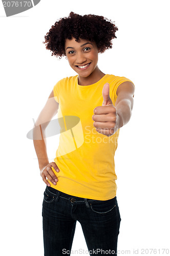 Image of Happy smiling lady showing thumbs up gesture