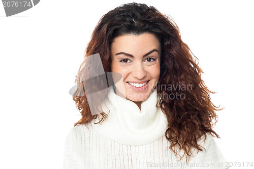 Image of Curly haired woman posing against white