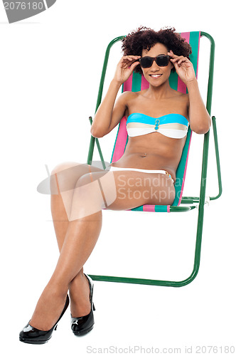 Image of Fashion lingerie model relaxing on deckchair