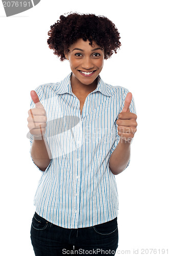 Image of Excited woman gesturing double thumbs up