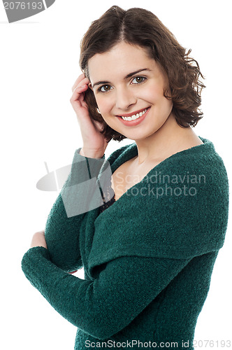 Image of Attractive female flirting with her hair