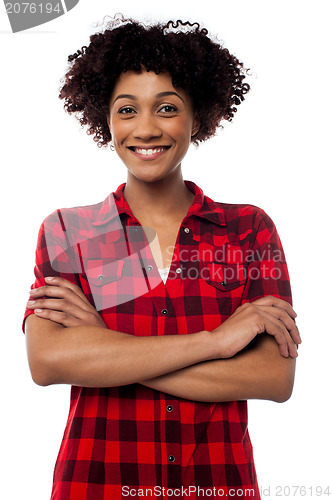 Image of Young woman in casuals, arms crossed