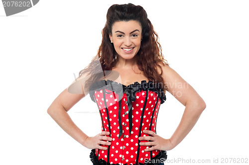 Image of Stylish woman in corset top striking a pose