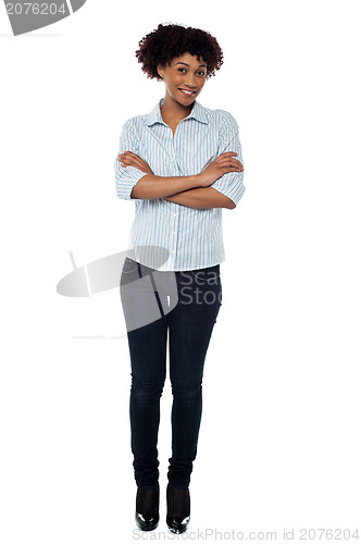 Image of Confident young female with folded arms