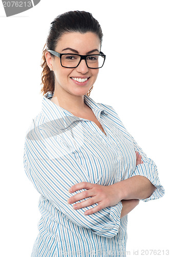 Image of Bespectacled lady striking pose sideways