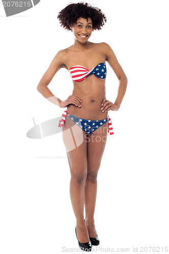 Image of Beautiful young woman in a stars and stripes bikini