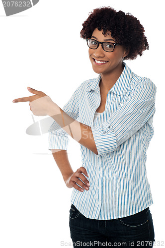 Image of Casual business lady indicating sideways