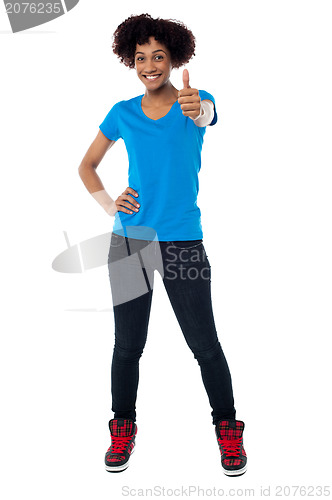 Image of Joyous young woman gesturing success