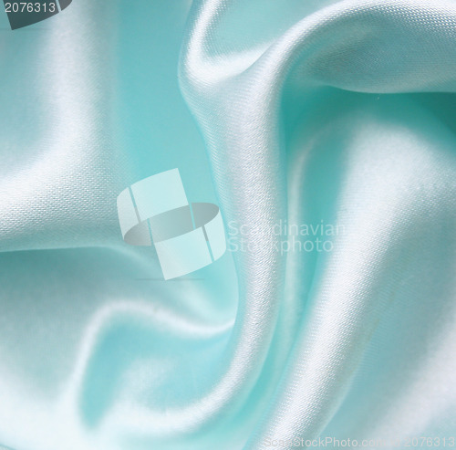 Image of Smooth elegant blue silk as background 