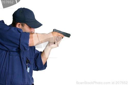 Image of Officer on duty handling a weapon