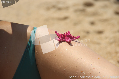 Image of Beautiful female hips on the beach 