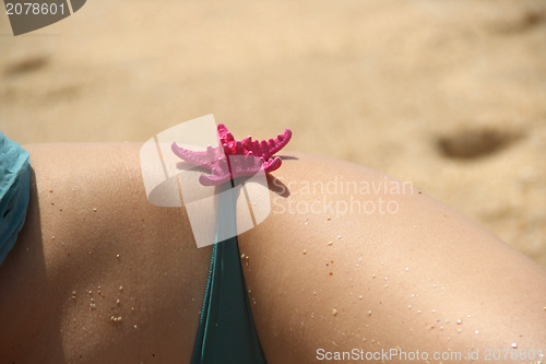 Image of Beautiful female hips on the beach 