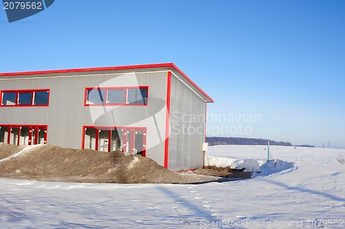 Image of Frozen construction among winter field
