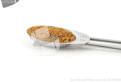 Image of Ground coriander measured in a metal teaspoon