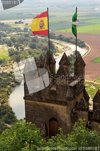 Image of Almodovar Del Rio medieval castle with flags of Spain and Andalusia