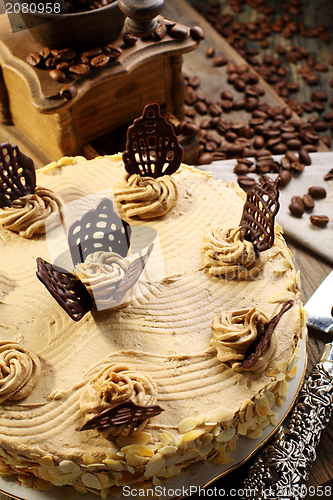 Image of Cake and coffee grinder.