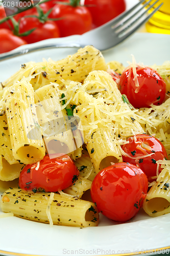 Image of Pasta with tomato and cheese.