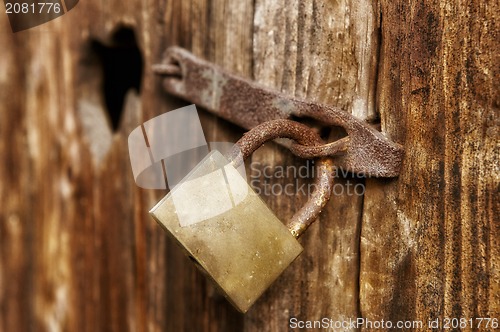 Image of Old window with closed woody shutter